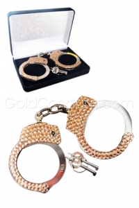 Handboeien bezet met gouden kristallen